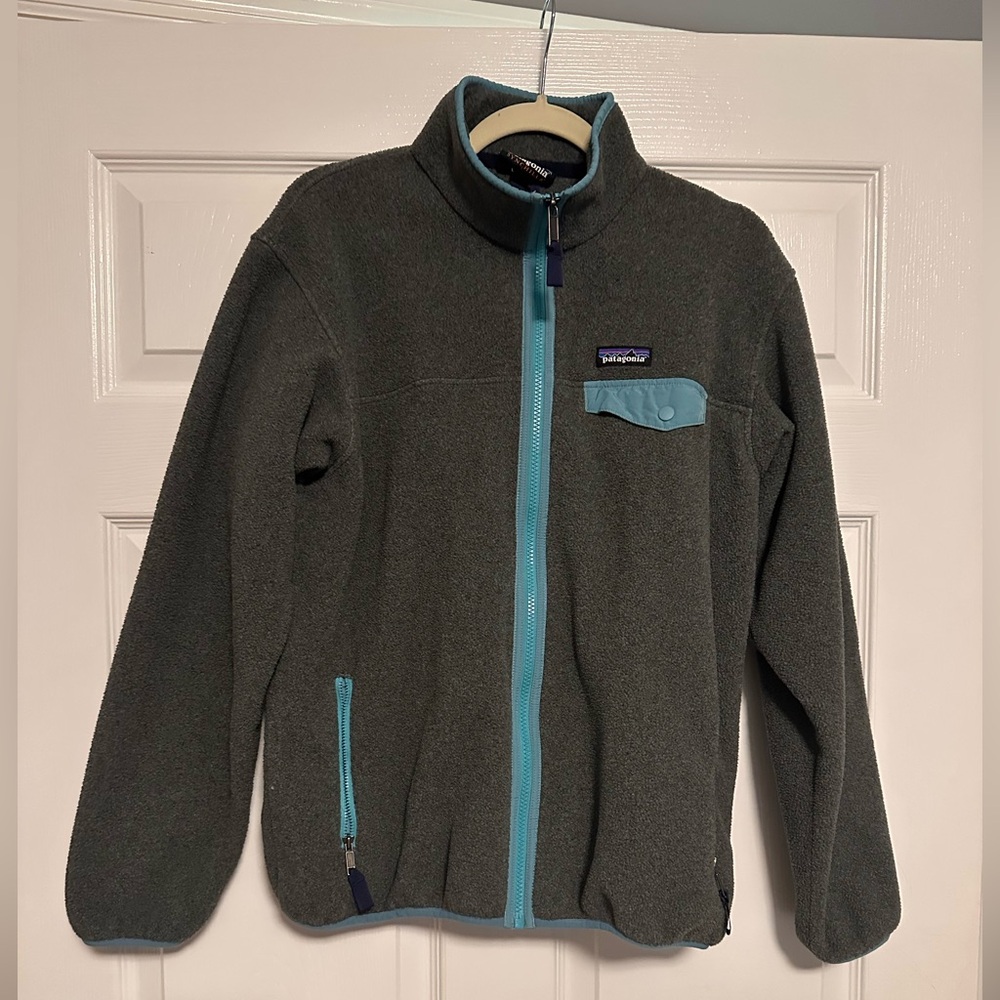 Grey full zip Patagonia jacket with blue/teal detailing
